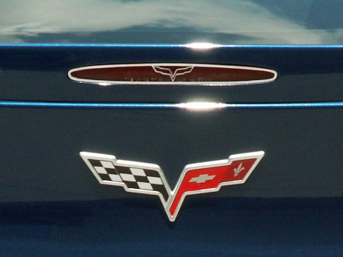 American Car Craft 2005-2013 Chevrolet Corvette 5th Brake Light Trim Crossed Flags Style GM Licensed 042115
